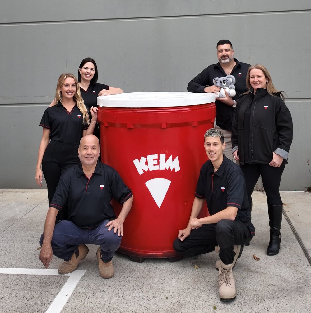 The KEIM Australia team with a giant KEIM paint bucket outside the Matraville showroom